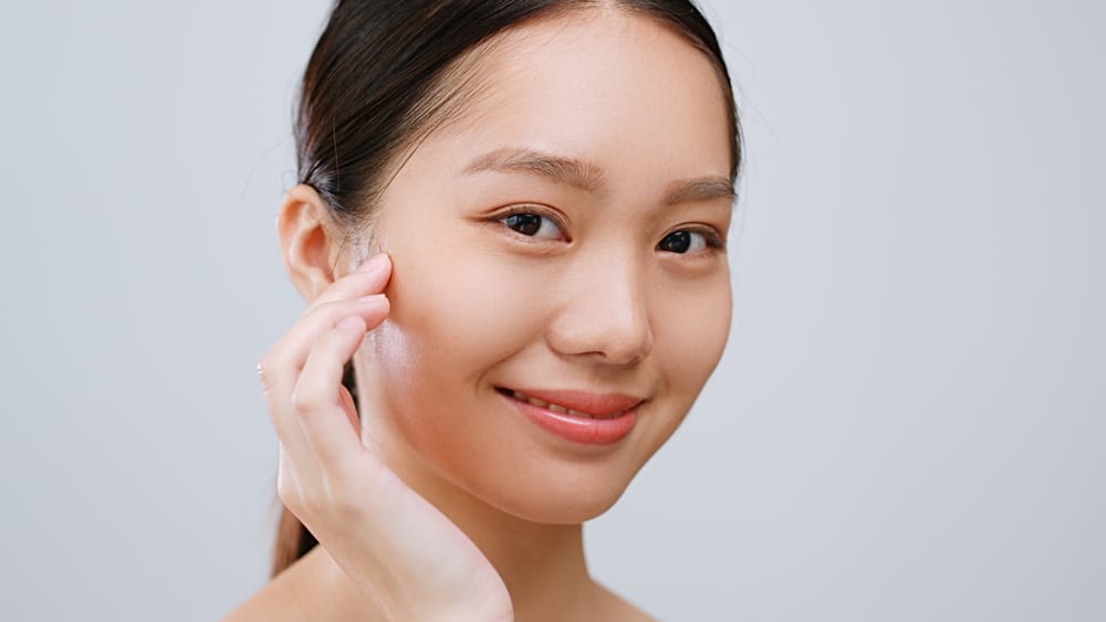 young woman with clear skin and youthful glow