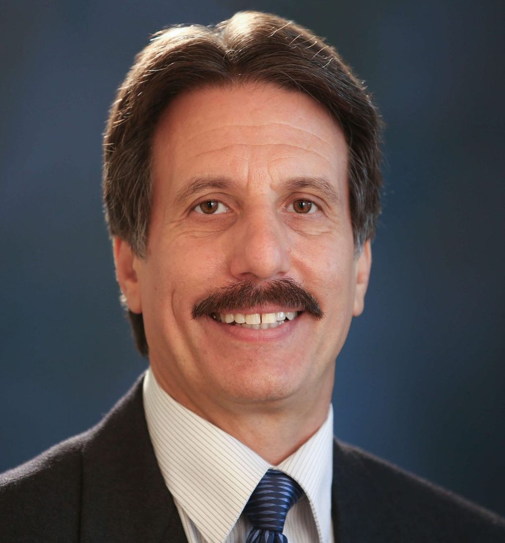 Headshot of Anthony Bonfiglio, FAAD, MD, board-certified dermatologist at Forefront Dermatology