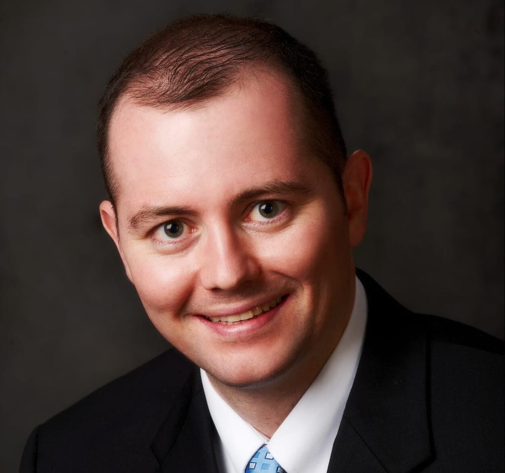 Headshot of Kevin M. Crawford, FAAD, MD, board-certified dermatologist at Forefront Dermatology