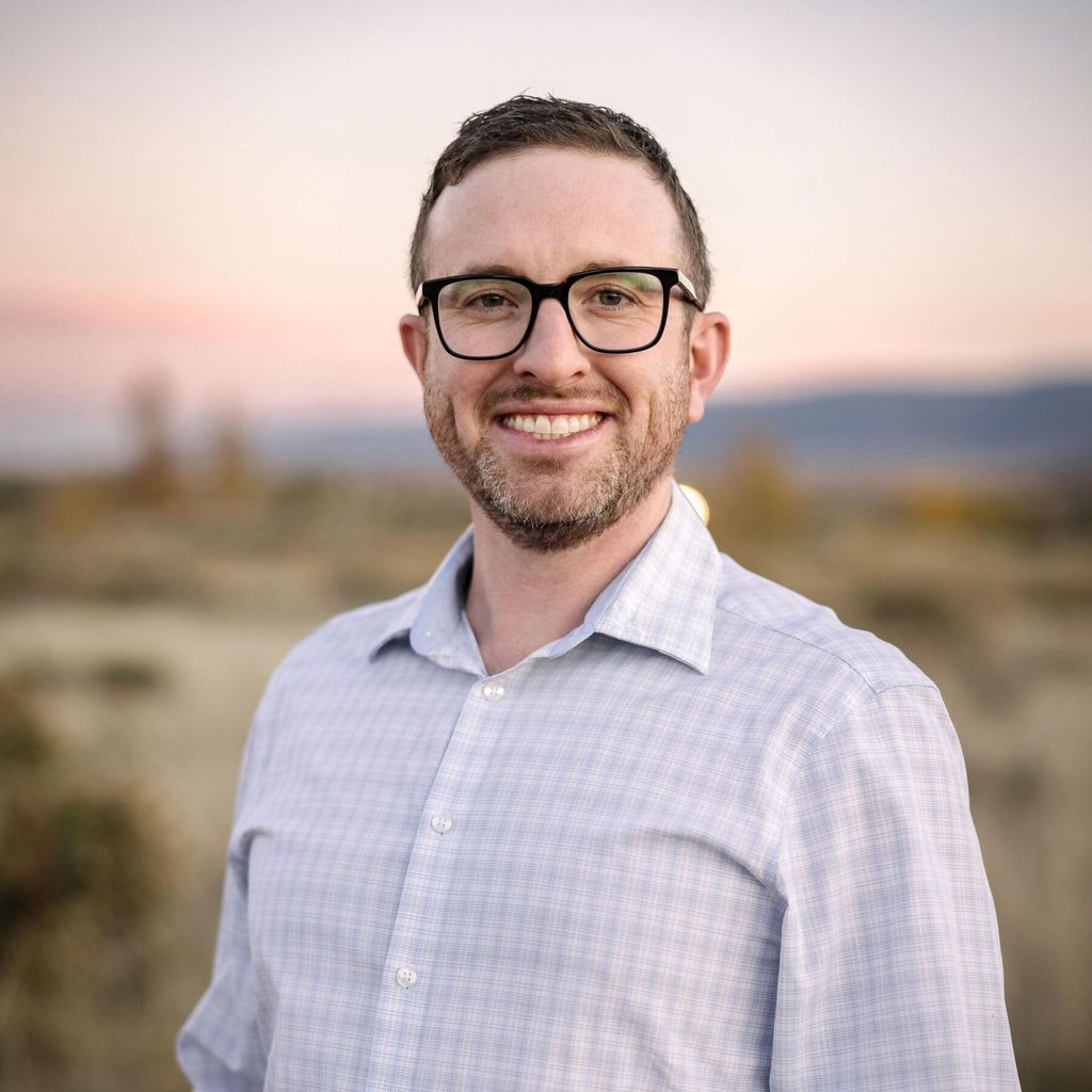 Headshot of Tyler Lee Quest, FAAD, MD, board-certified dermatologist at Casper Dermatology Clinic