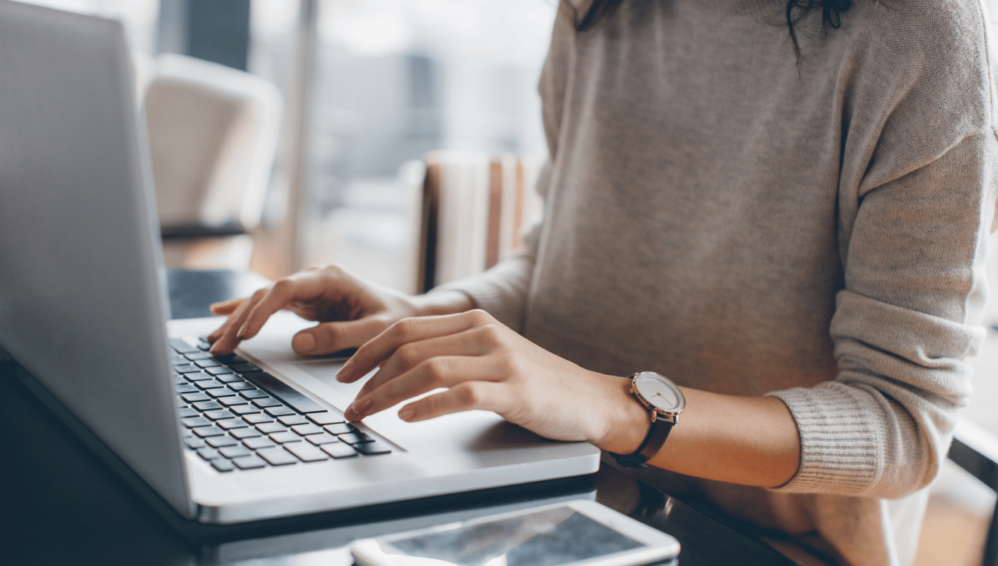 Person reviewing insurance and billing information on a laptop