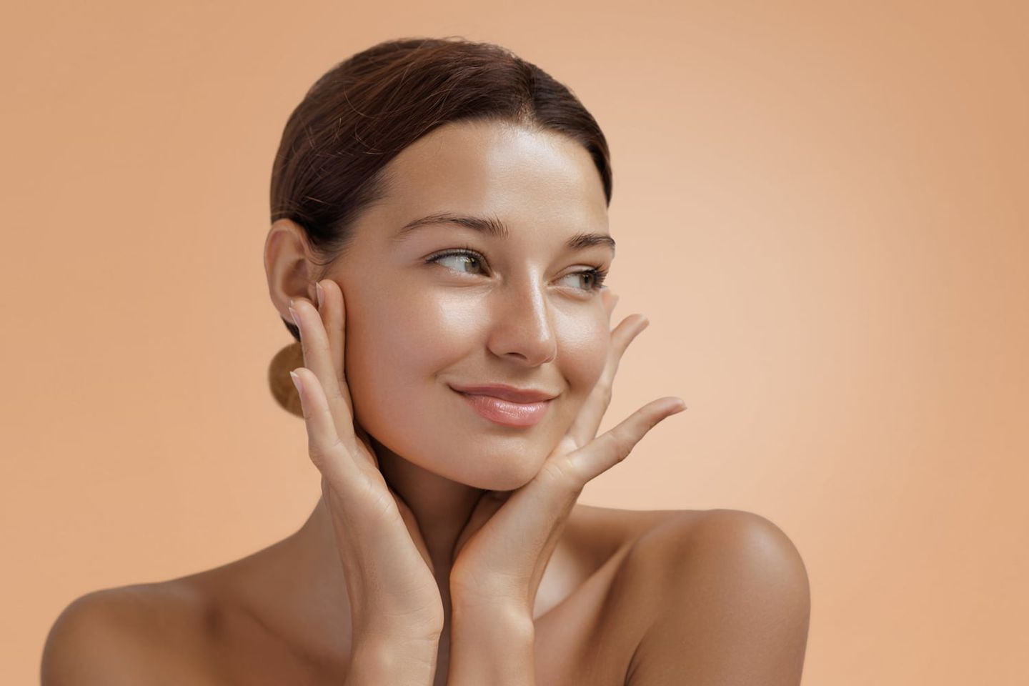 Happy beautiful young adult woman showing her perfect face with healthy smooth skin after BOTOX cosmetic treatment.