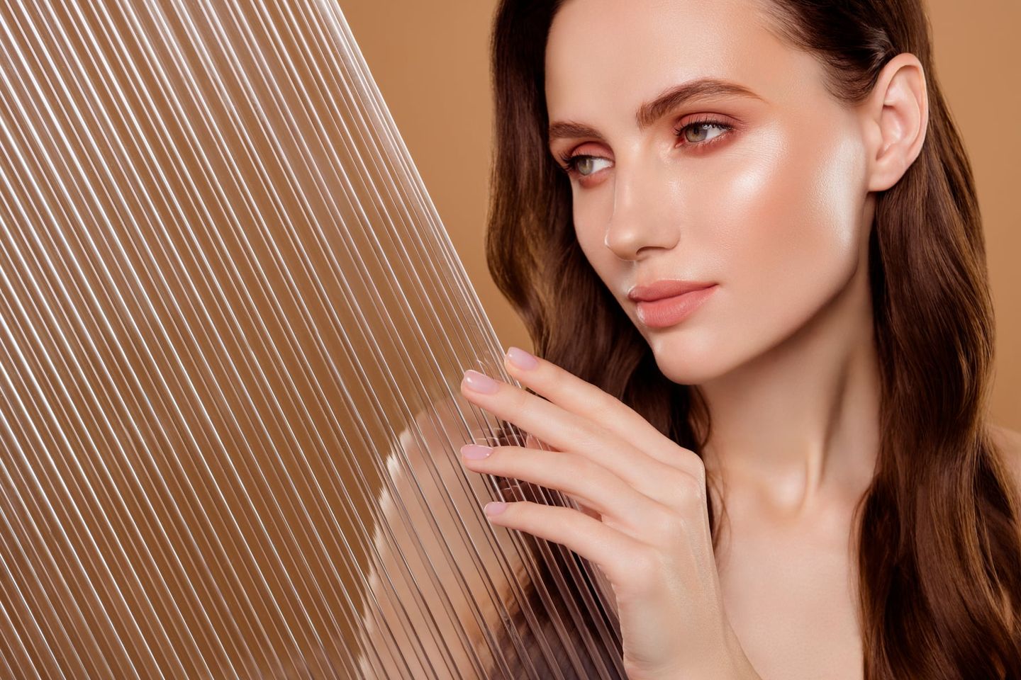Photo of gorgeous lady cosmetician hold plastic grid for body skin care procedure on pastel color background