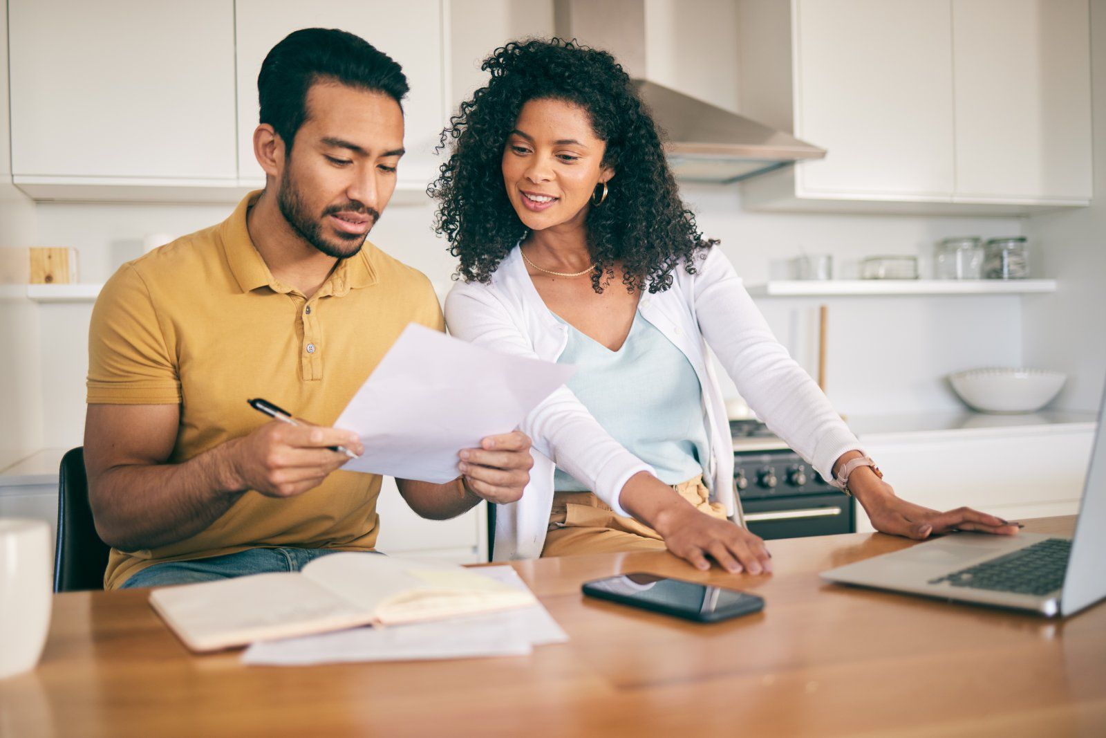 A couple reviewing a medical bill together at home