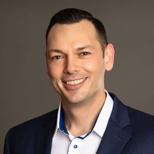 Headshot of Kurt W. Grelck, DO, FAAD, FAOCD, board-certified dermatologist at Forefront Dermatology