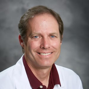 Headshot of J. Scott Kasteler, FAAD, MD, board-certified dermatologist at Forefront Dermatology