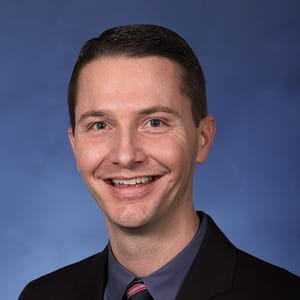 Headshot of Christopher M. Hunzeker, FAAD, FACMS, MD, board-certified dermatologist at Forefront Dermatology