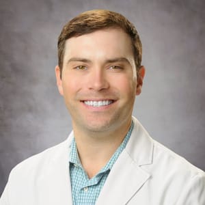 Headshot of Rhett Kent, FAAD, MD, board-certified dermatologist at Forefront Dermatology