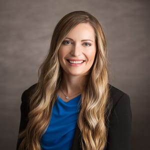 Headshot of Ashley Dietrich, FAAD, MD, board-certified dermatologist at Forefront Dermatology