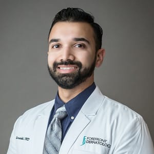 Headshot of Azam Qureshi, FAAD, MD, board-certified dermatologist at Forefront Dermatology