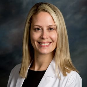 Headshot of Alexis Lyons, FAAD, MD, board-certified dermatologist at Forefront Dermatology