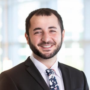 Headshot of Tudor Puiu, FAAD, MD, board-certified dermatologist at Forefront Dermatology