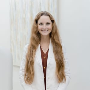 Headshot of Caroline Daggett, MD, board-certified dermatologist at Haley Dermatology