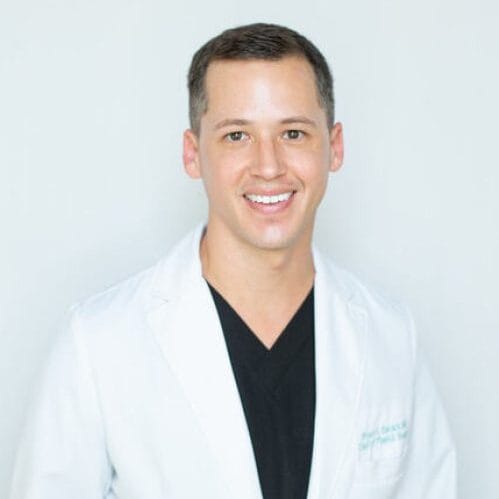 Headshot of Joshua Stephen Black, MD, board-certified dermatologist at Germain Dermatology