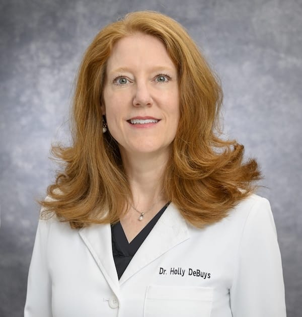 Headshot of Holly DeBuys, FAAD, MD, board-certified dermatologist at Compassion Dermatology