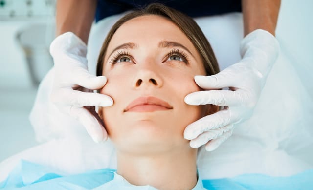 woman receiving cosmetic treatment from a board certified dermatologist