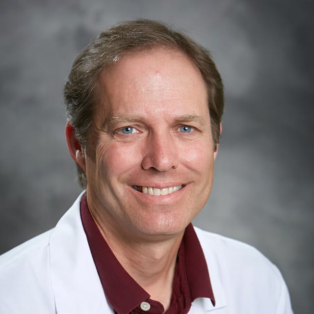 Headshot of J. Scott Kasteler, FAAD, MD, board-certified dermatologist at Forefront Dermatology