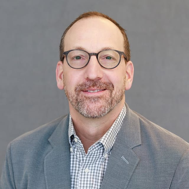 Headshot of Gregory J. Bezanis, FAAD, MD, board-certified dermatologist at Premier Dermatology