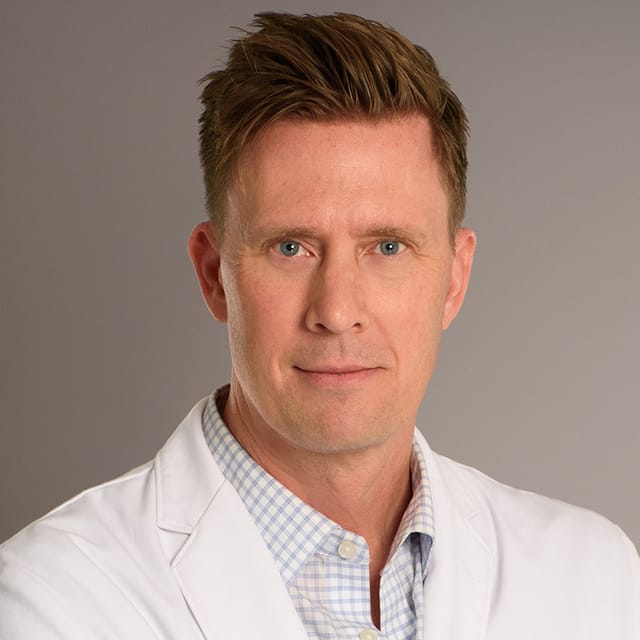 Headshot of John Soderberg, FAAD, MD, MPH, board-certified dermatologist at Forefront Dermatology