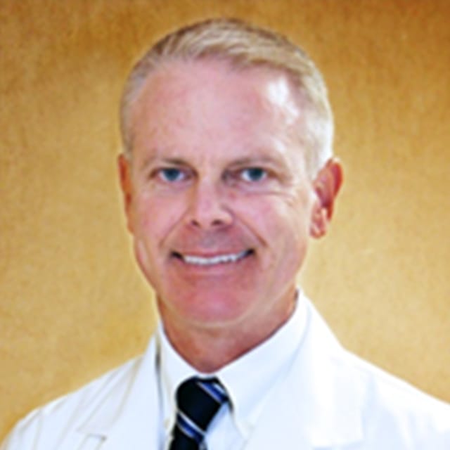 Headshot of Cary Dunn, FAAD, FACMS, MD, board-certified dermatologist at Advanced Dermatology & Skin Care Centre