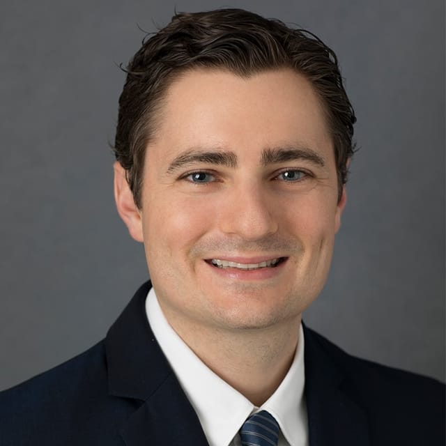 Headshot of Jordan Brooks, FAAD, MD, board-certified dermatologist at Atlantic Shore Dermatology