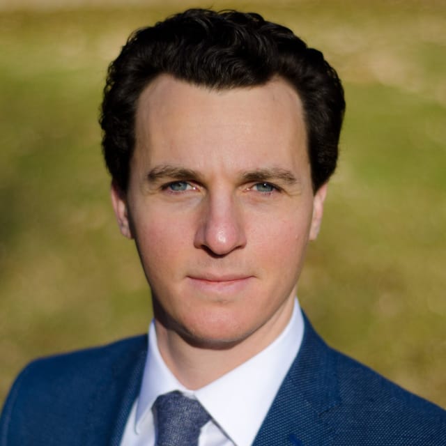 Headshot of August A. Natalie, FAAD, MD, board-certified dermatologist at Forefront Dermatology