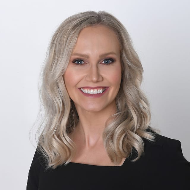 Headshot of Sarah Storm Gross, FAAD, MD, board-certified dermatologist at Forefront Dermatology