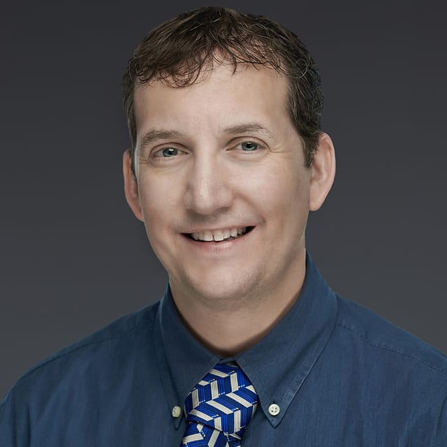 Headshot of Scott Carrizales, FAAD, MD, board-certified dermatologist at Forefront Dermatology