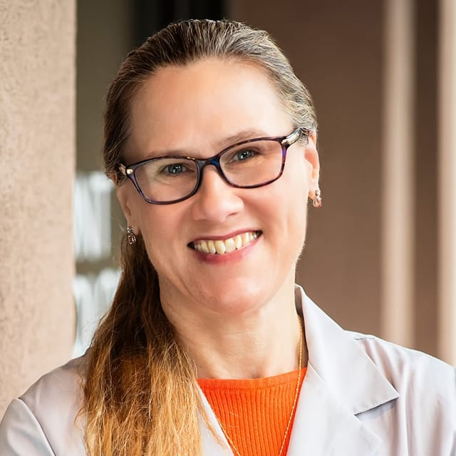 Headshot of Alexandria Meccia, FAAD, MD, board-certified dermatologist at Forefront Dermatology