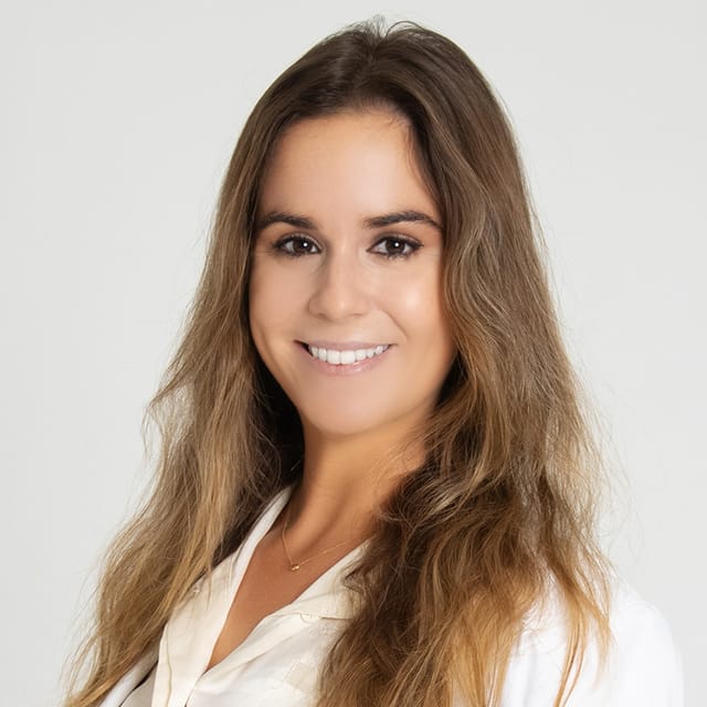 Headshot of Amanda McIntire Daggett, FAAD, MD, board-certified dermatologist at Forefront Dermatology