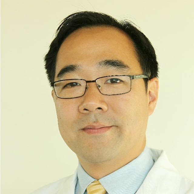Headshot of Aric Park, MD, board-certified otolaryngologist at Forefront Dermatology