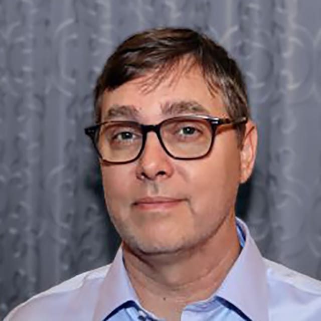 Headshot of Ray Johnson, FAAD, MD, board-certified dermatologist at Arizona Dermatology Group