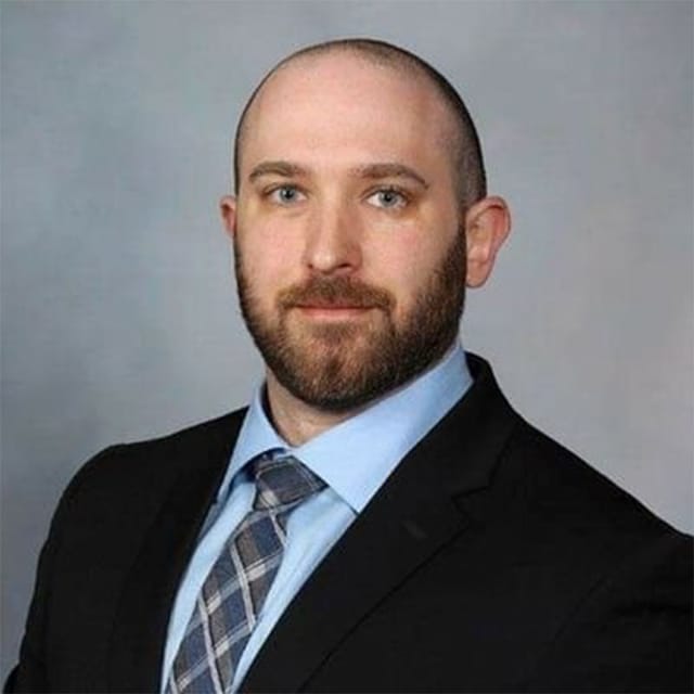 Headshot of Bruce Leckey, DO, board-certified dermatopathologist at Forefront Dermatology