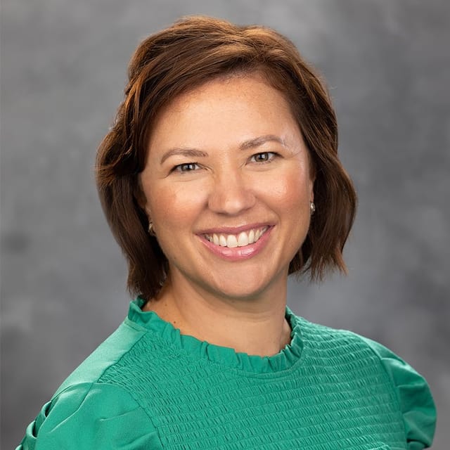Headshot of Erin Devanney, FNP-BC, family nurse practitioner at Forefront Dermatology