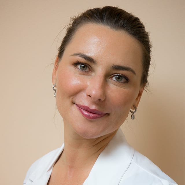 Headshot of Dorota Wilson, FAAD, MD, board-certified dermatologist at Forefront Dermatology