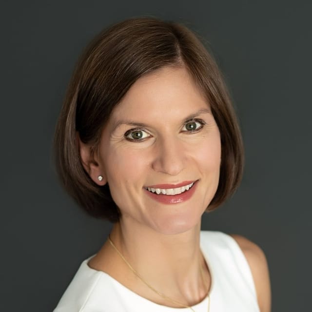 Headshot of Gina Spohn, FAAD, MD, board-certified dermatologist at Forefront Dermatology