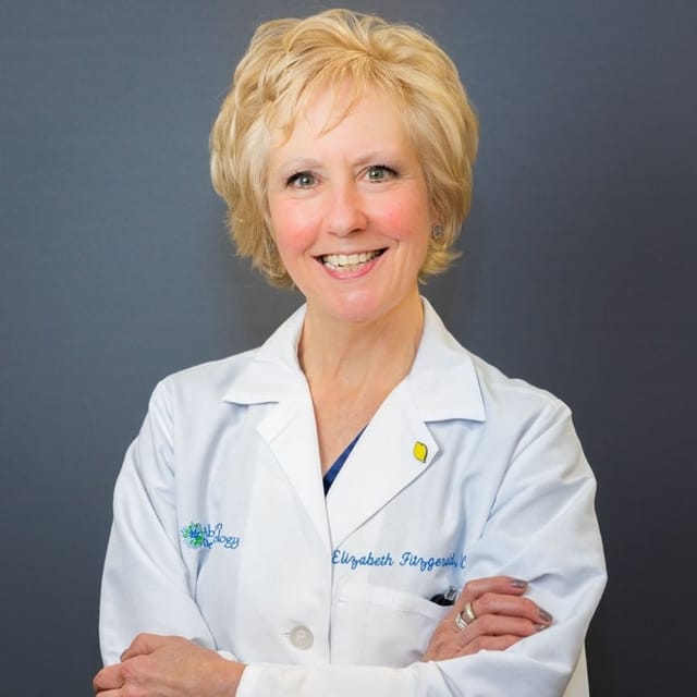 Headshot of Elizabeth Fitzgerald Voye, DO, board-certified dermatologist at Forefront Dermatology