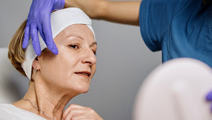 Patient receiving facelift consultation