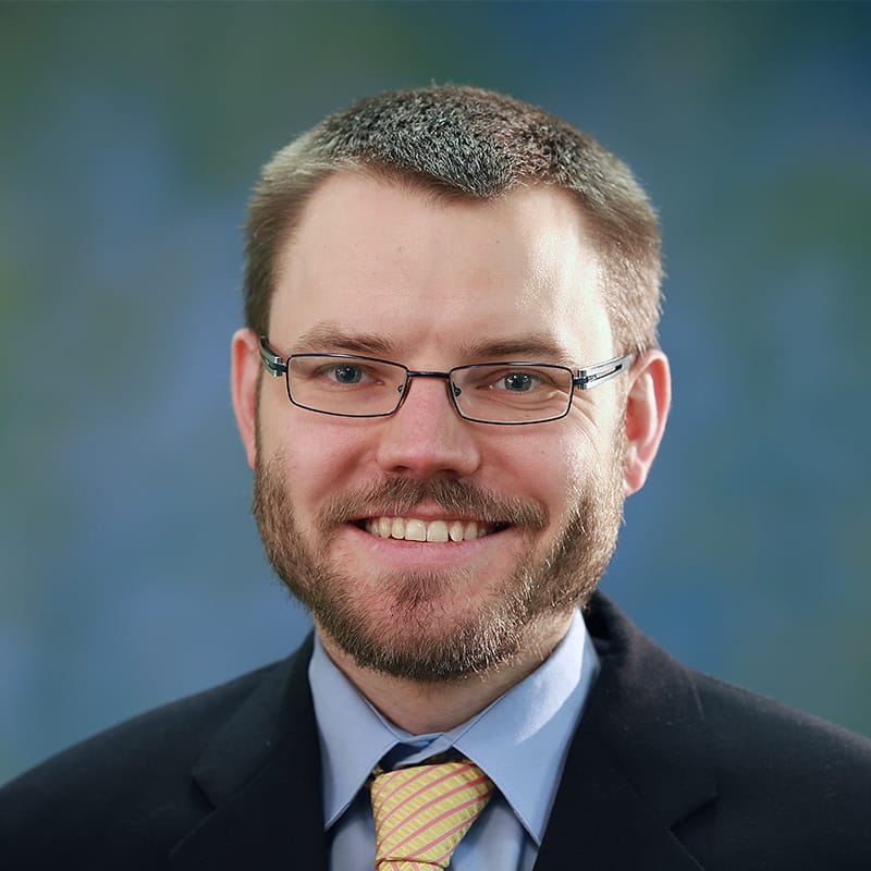 Headshot of Erik C. Alexander, FAAD, MD, board-certified dermatologist at Forefront Dermatology