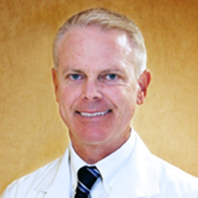 Headshot of Cary Dunn, FAAD, FACMS, MD, board-certified dermatologist at Advanced Dermatology & Skin Care Centre