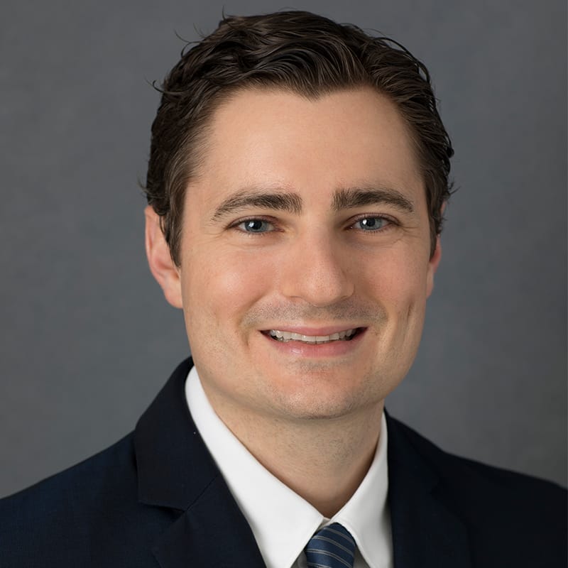 Headshot of Jordan Brooks, FAAD, MD, board-certified dermatologist at Atlantic Shore Dermatology