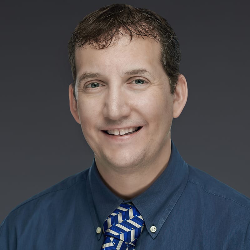 Headshot of Scott Carrizales, FAAD, MD, board-certified dermatologist at Forefront Dermatology