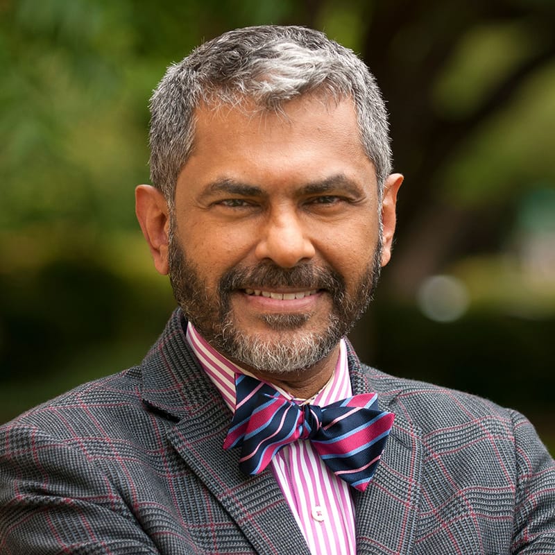 Headshot of Abraham Kuruvilla, FAAD, MD, board-certified dermatologist at Forefront Dermatology