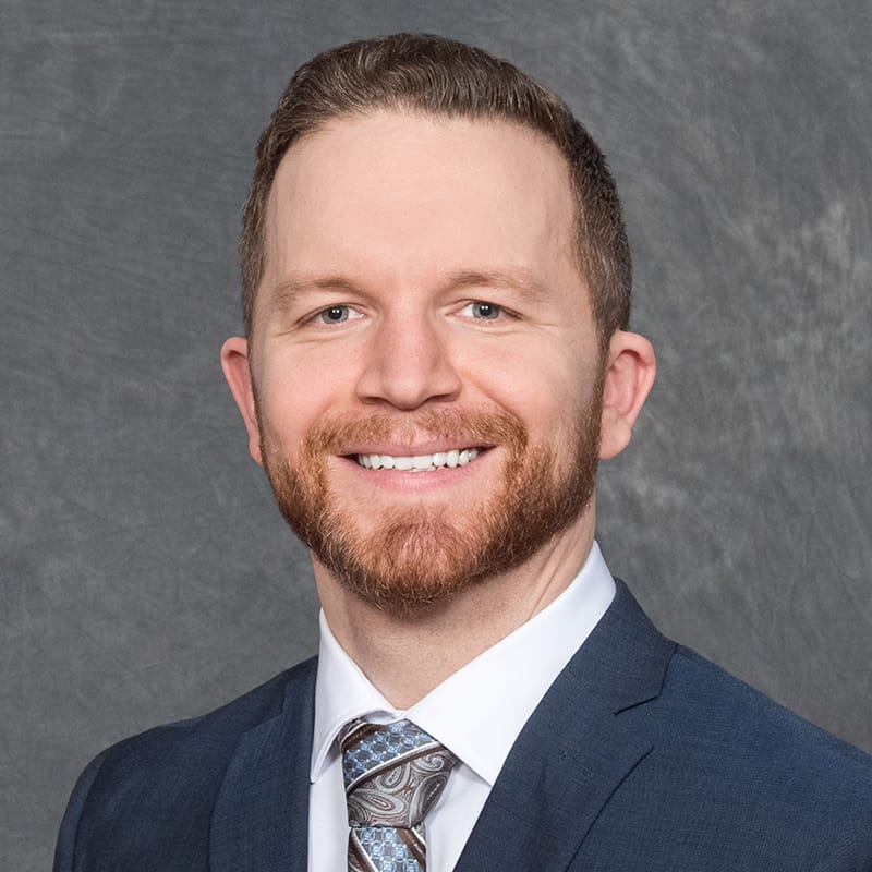 Headshot of Andrew Carlo Hankinson, FAAD, FACMS, MD, board-certified dermatologist at Forefront Dermatology