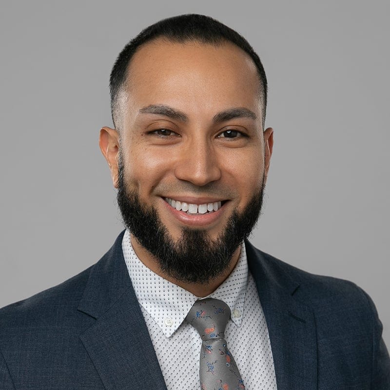 Headshot of Andrew R. Villanueva, MD, board-certified dermatologist at Forefront Dermatology