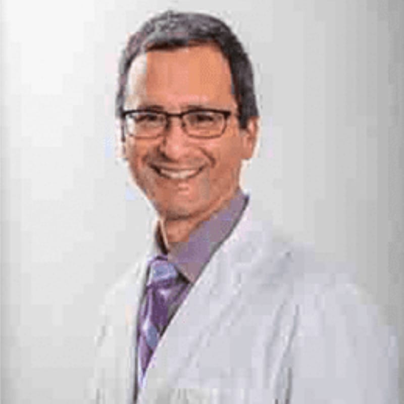 Headshot of James Dinulos, FAAD, MD, board-certified dermatologist at Seacoast Dermatology