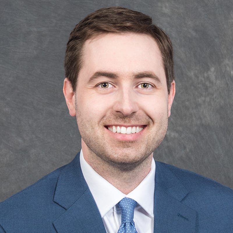 Headshot of Casey Logan, FAAD, MD, board-certified dermatologist at Forefront Dermatology