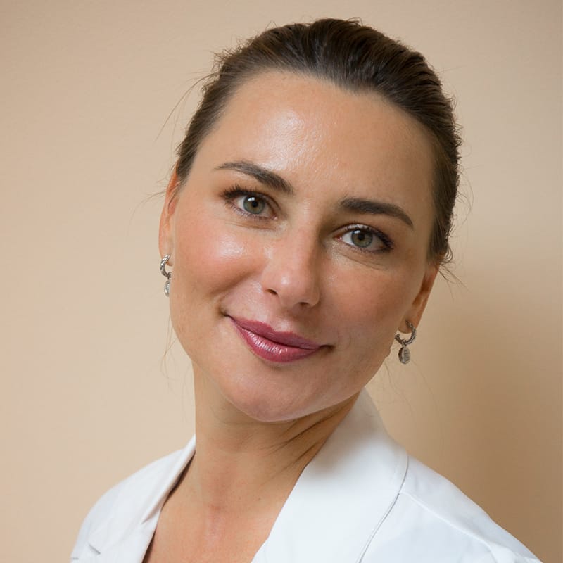 Headshot of Dorota Wilson, FAAD, MD, board-certified dermatologist at Forefront Dermatology