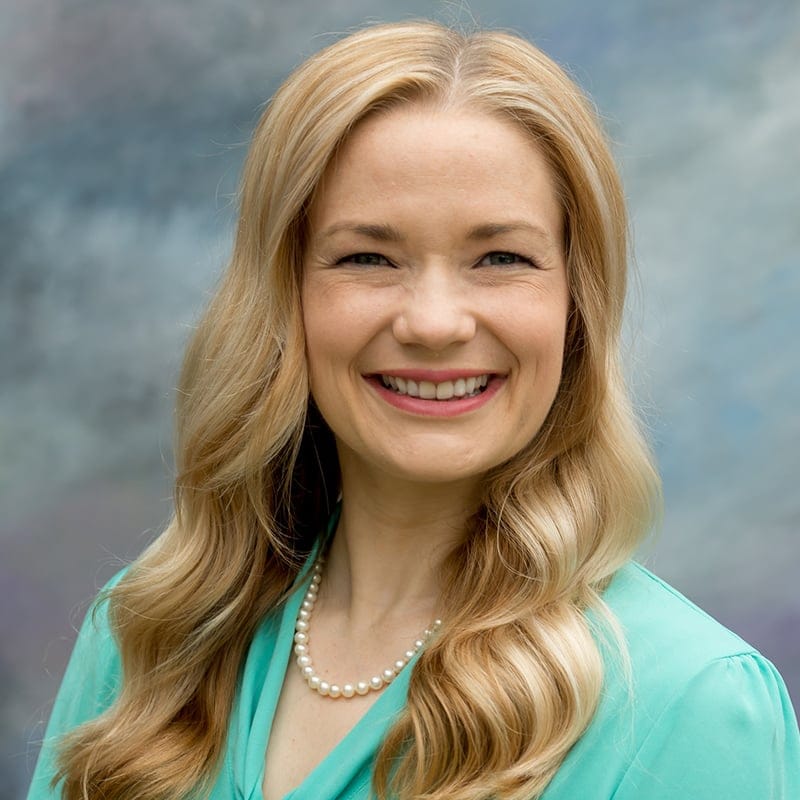 Headshot of Christina Artz, FAAD, MD, board-certified dermatologist at Forefront Dermatology