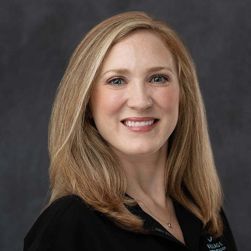 Headshot of Caroline Crabtree, FAAD, MD, board-certified dermatologist at Village Dermatology